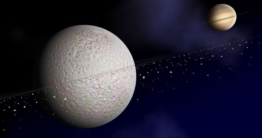 Månen Rhea er bare 1.500 kilometer i diameter. Likevel har astronomene nå funnet materiale som sirkler rundt månen, som dermed ser ut til å ha sitt eget ringsystem, akkurat som moderplaneten Saturn.