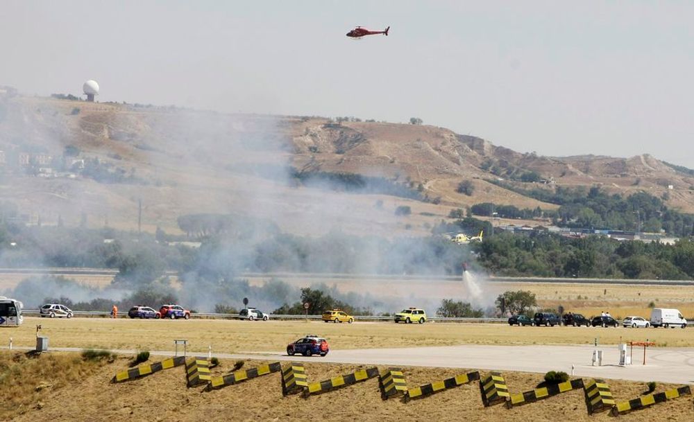 Redningsmannskaper, brannbiler og helikoptre omringet Barajas flyplass i Madrid etter at et fly skled av rullebanen onsdag 17. september. 153 mennesker skal ha mistet livet i ulykken.