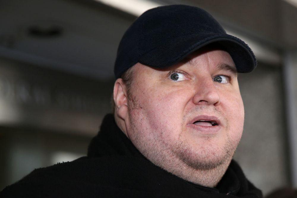 This file photo taken on December 23, 2015 shows internet mogul Kim Dotcom leaving court in Auckland after a judge ruled that he and three other defendants are eligible for extradition to the US. New Zealand's High Court ruled on February 20, 2017 that Kim Dotcom was eligible for extradition to the US over allegations of online piracy linked to his now-defunct Megaupload web empire.