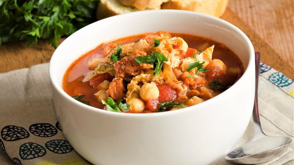 Delicious chorizo, cabbage and chickpea soup in a bowl