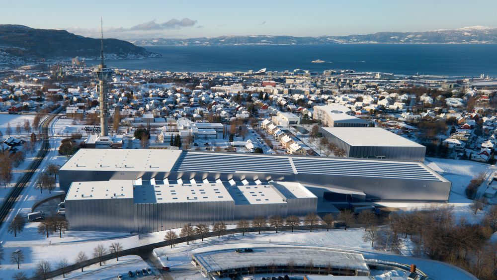 Fugleperspektiv av det nye marintekniske senteret, Ocean Space Centre, i Trondheim. Tyholt med det kjente tårnet og Trondheimsfjorden i bakgrunnen.