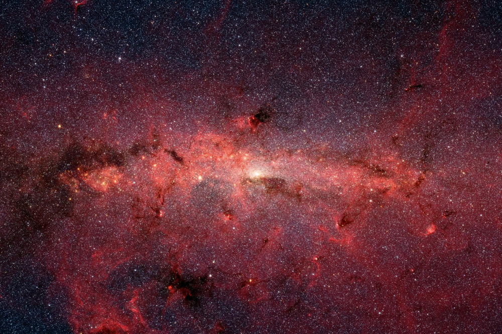 Finnes det noe annet liv i universet, eller er vi alene? For å begrense søket etter liv i universet er det nødvendig å kjenne til betingelsene for liv på jorden. Dette bildet viser hvordan det ser ut i midten av vår egen galakse, Melkeveien.