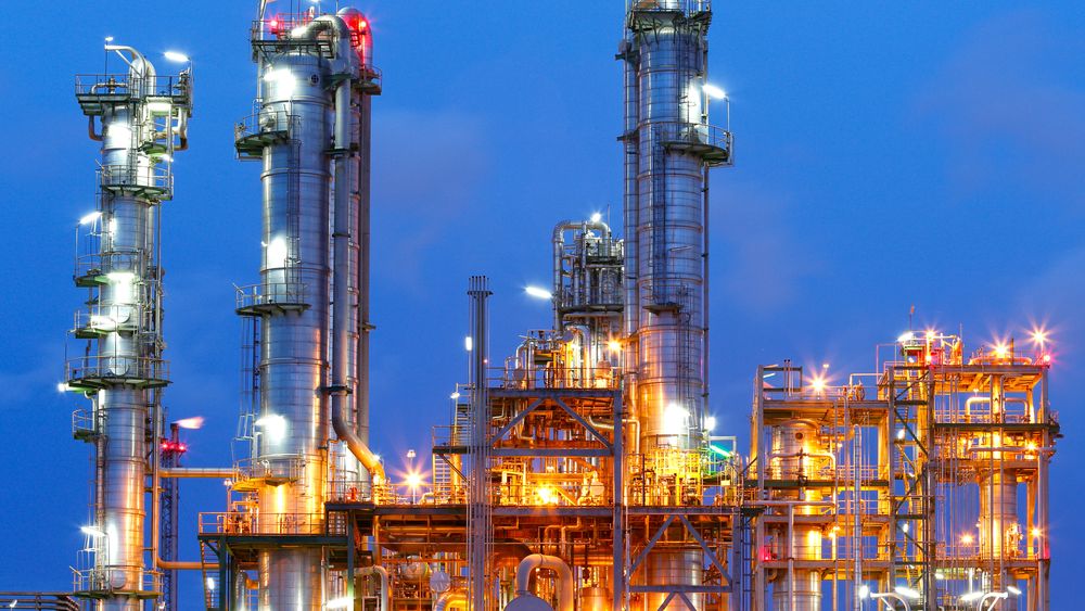 Lighting from structure of oil and chemical factory with blue sky background