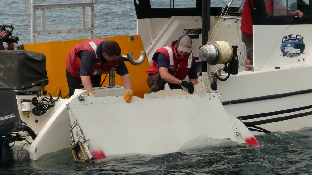 A Boeing 777 flaperon cut down to match the one from flight MH370 found on Reunion island off the coast of Africa in 2015, is lowered into water to discover its drift characteristics by Commonwealth Scientific and Industrial Research Organisation researchers in Tasmania, Australia, in this handout image taken March 23, 2017. CSIRO/Handout via REUTERS TPX IMAGES OF THE DAY FOR EDITORIAL USE ONLY. THIS IMAGE HAS BEEN SUPPLIED BY A THIRD PARTY. IT IS DISTRIBUTED, EXACTLY AS RECEIVED BY REUTERS, AS A SERVICE TO CLIENTS