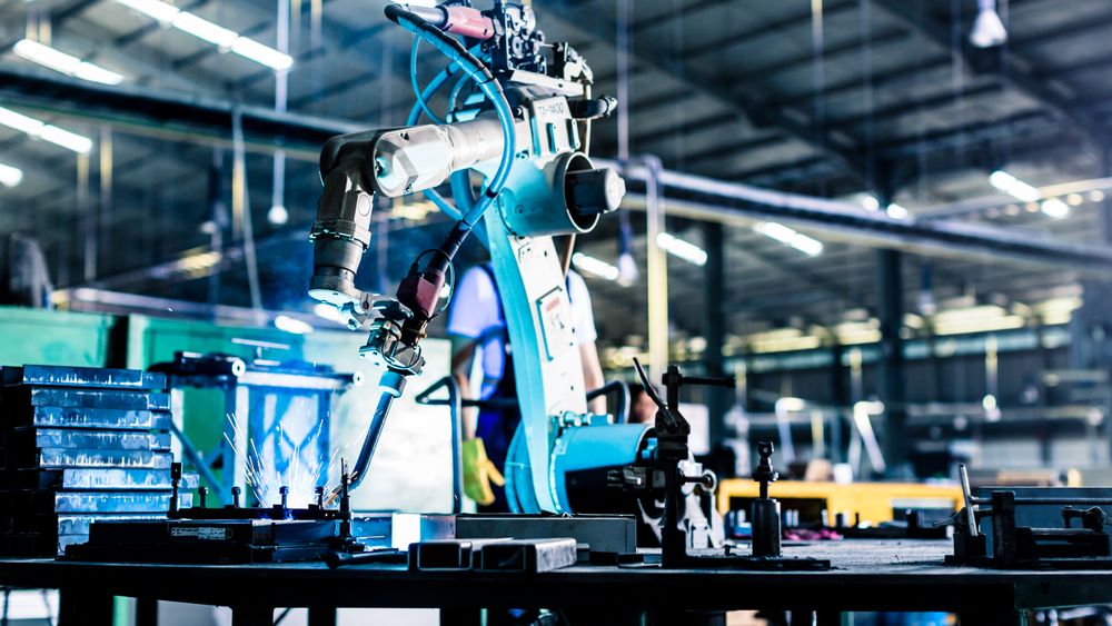 Welding robot in production plant or factory