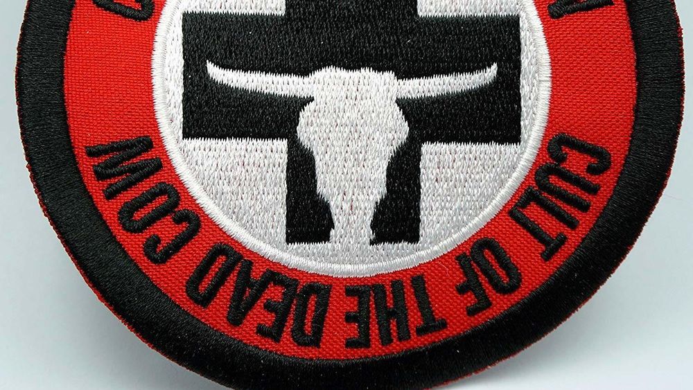 Tøymerke med logoen til hackergruppen Cult of the Dead Cow.