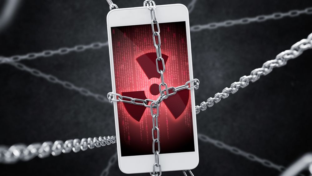 Imprisoned smartphone with encrypted data. Conception of virus threat