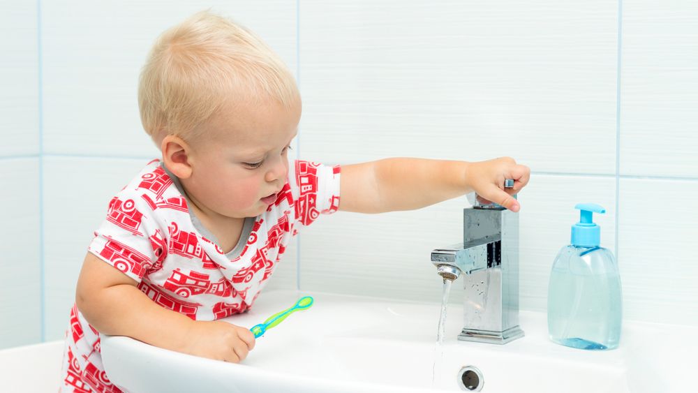 Cute toddler boy brushing teeth. Teeth cleaning, dental care. adorable baby boy washing up.