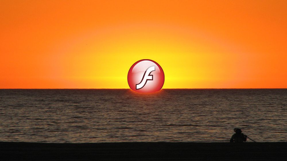 Logoen til Adobe Flash Player forsvinner ned i havet. Illustrasjonsfoto.