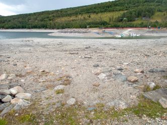 Det varme sommerværet førte til nok en nedgang i fyllingsgraden i norske vannmagasiner i forrige uke. Her et bilde fra vannmagasinet Gjevilvatnet i Oppdal. Foto:  Gorm Kallestad/NTB Scanpix