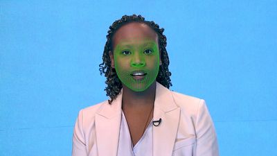 Et grønt tilpasset rutenett dekker ansiktet til en kvinnelig skuespiller som viser syntetisk reanimering av ansiktet, bedre kjent som deepfake-videoer.