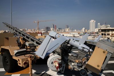 A ScanEagle drone sits on the deck of the USS Ponce in Manama, Bahrain, Friday, Dec. 6, 2013. Standing on the massive deck of the Navy’s USS Ponce, Hagel said the U.S. is entering the new nuclear pact with Iran “very clear eyed” and it remains to be see whether Tehran is serious about keeping its development peaceful. (AP Photo/Mark Wilson, Pool) 