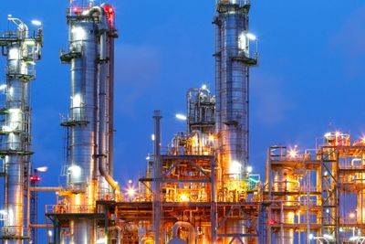 Lighting from structure of oil and chemical factory with blue sky background