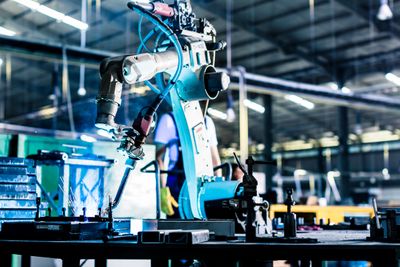 Welding robot in production plant or factory