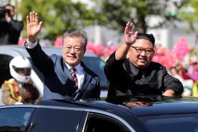 FILE - In this Sept. 18, 2018, file photo, South Korean President Moon Jae-in, left, and North Korean leader Kim Jong Un ride in a car during a parade through a street in Pyongyang, North Korea. Day after day, rampant speculation about North Korean leader KimÄôs possible trip to Seoul is making headlines in South Korea, despite no official confirmation from both Koreas. Many analysts say it would be virtually impossible for Kim to fulfill his reported promise to become the first North Korean ruler to visit South Korea by the end of this year, given stalemated nuclear diplomacy. But others say we never know until this year is over. (Pyongyang Press Corps Pool via AP, File)