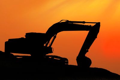 Silhouetted Digging Machine