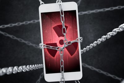 Imprisoned smartphone with encrypted data. Conception of virus threat