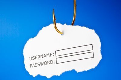 'Username and password' on a fishing hook. Conceptual image about the risk of internet identity theft, also known as 'Phishing'. 