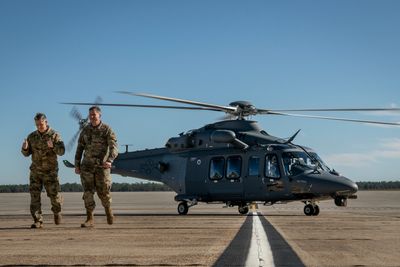 Gen. Timothy Ray, Air Force Global Strike Command commander, gives thumbs up after disembarking his first ride in the MH-139A Grey Wolf with Col. Michael Jiru, Air Force Materiel Command. The Grey Wolf was unveiled and named during the ceremony at Duke Field, Fla., Dec. 19, 2019. (U.S Air Force photo/Samuel King Jr.)