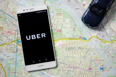 WROCLAW, POLAND - DEC 13,2017 : Uber logo on Huawei P9. Uber is sharing-economy service for ubran tr ...