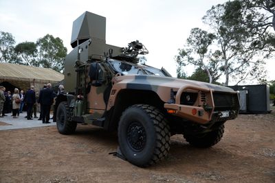 An Australian Army Hawkei Protected Mobility Vehicle with a mock-up of a CEA Technologies Tactical R ...