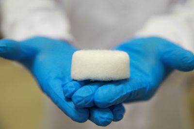 An NUS researcher shows an Aerogel pellet at NUS's Department of Mechanical Engineering in Singapore ...