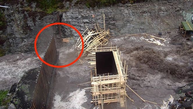 Den gamle demningen ble revet før den nye kom på plass. Dermed ble den midlertidige fangdammen siste skanse. Når den brast fosset vannet ned mot Eidsvåg og over 40 hus ble evakuert. Skjermbilde: Bergen Brannvesen