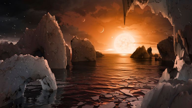 Dette bildet viser en kunstners oppfatning av hvordan overflaten til eksoplaneten TRAPPIST-1f kan se ut, basert på tilgjengelige data om dens diameter, masse og avstander fra vertsstjernen. James Webb-teleskopet finner ingen atmosfære på den jordlignende eksoplaneten. <i>Illustrasjon:  NASA/JPL-Caltech via AP / NTB</i>