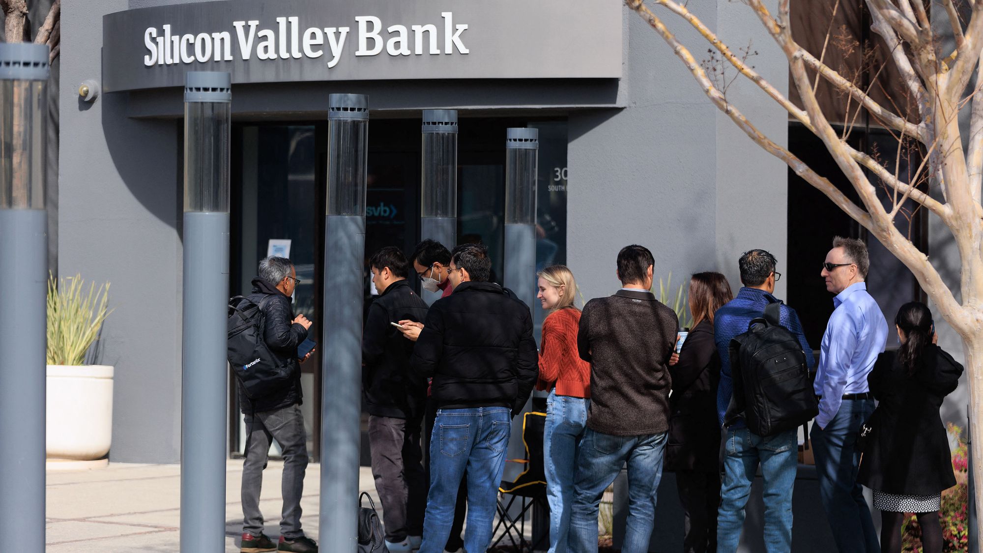 SANTA CLARA, CA, US - MARCH 13: People wait outside the Silicon Valley Bank headquarters in Santa Cl ...